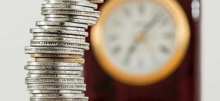 Selective Focus Photo of Stacked Coins