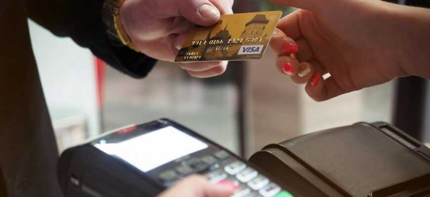 Close-up of a credit card payment being processed at a POS terminal.