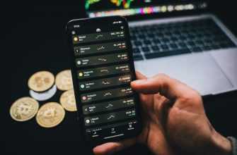 A Person Holding a Smartphone with Trading Graphs