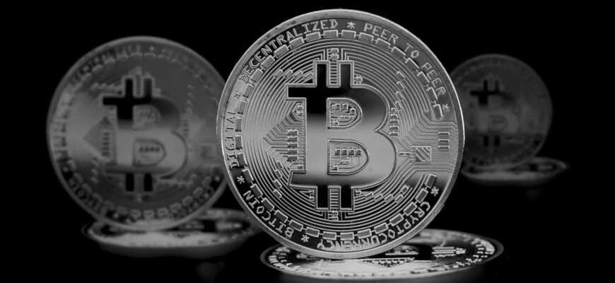 High contrast image of shiny Bitcoin coins symbolizing digital currency and finance.