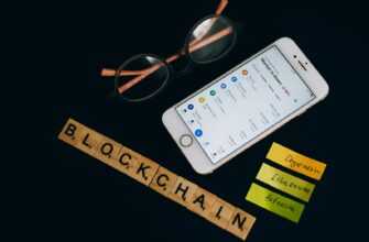 Smartphone displaying cryptocurrency market data alongside blockchain concept elements.