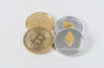 four round silver-colored and gold-colored Bitcoins