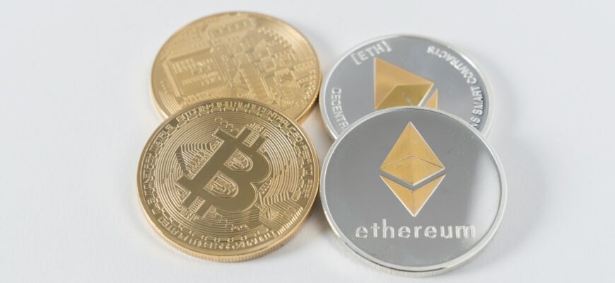 four round silver-colored and gold-colored Bitcoins