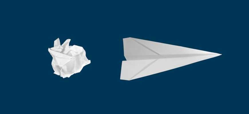 white paper plane on white background