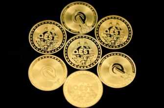 a group of five gold coins sitting on top of each other