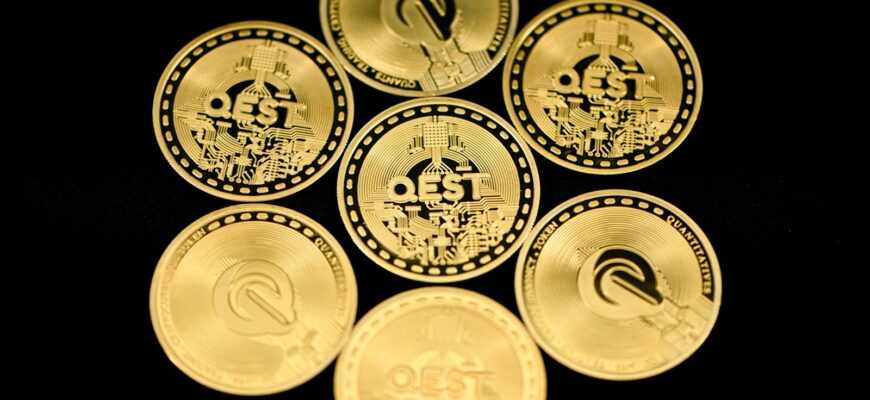 a group of five gold coins sitting on top of each other